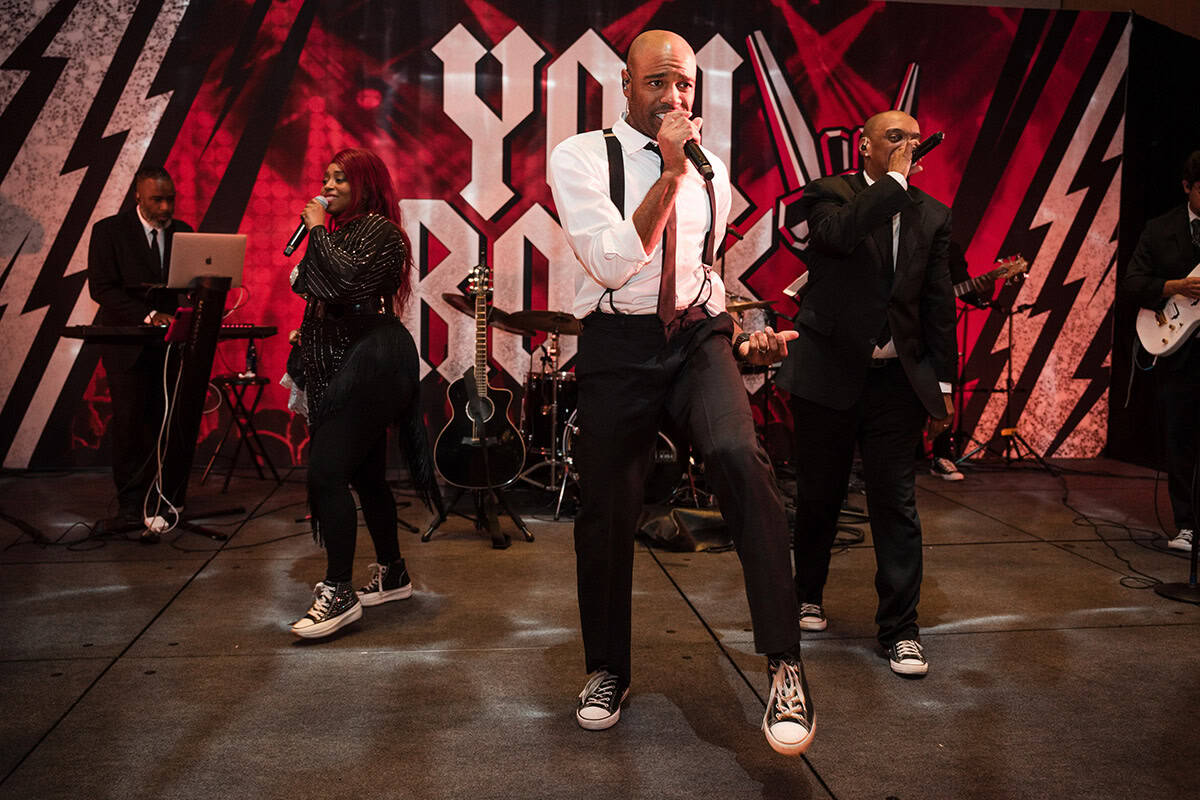 JCB-684 1 - metroConnections A band performs a song. The members are in suits and ties and wearing Converse shoes.