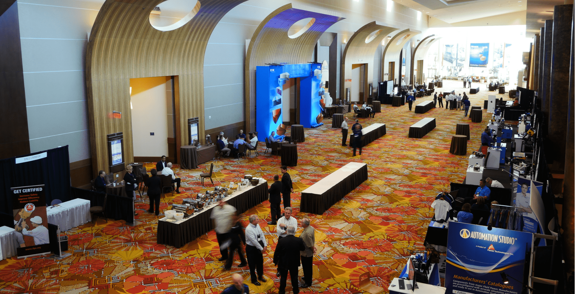 Attendees attending an Exhibit Hall for industry event