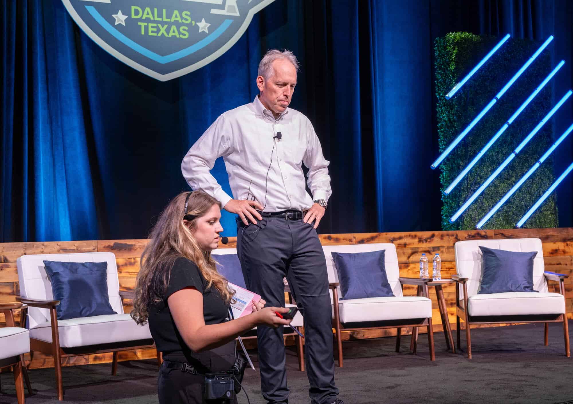 Event Stage Producer Prepares Client Before General Session Presentation